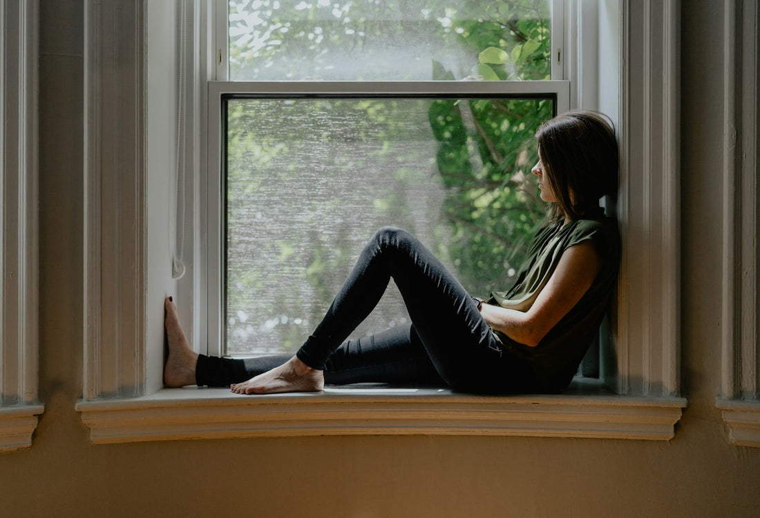 A woman looking out of a window