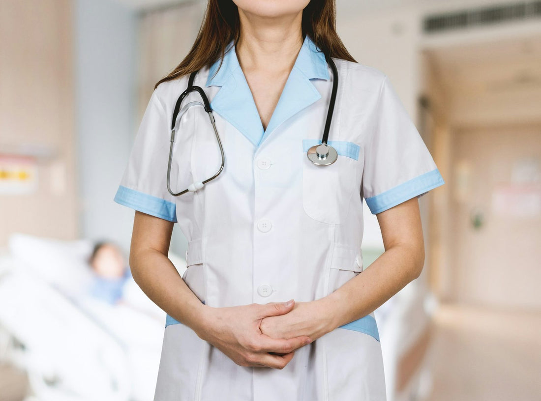 A nurse in uniform on a hospital ward