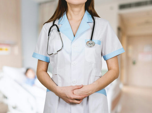 A nurse in uniform on a hospital ward