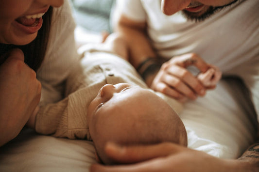 New parents at home with their baby
